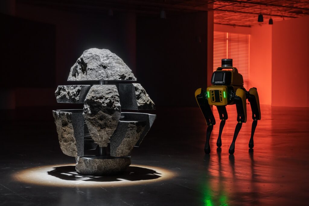To Build a Fire: stone sculpture, robot, color video with lighting, sound and kinetic blinds, 2022-2024